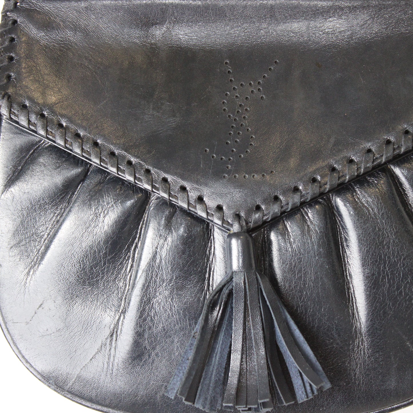 Yves Saint Laurent Perforated Logo Tassel Black Leather Crossbody Bag