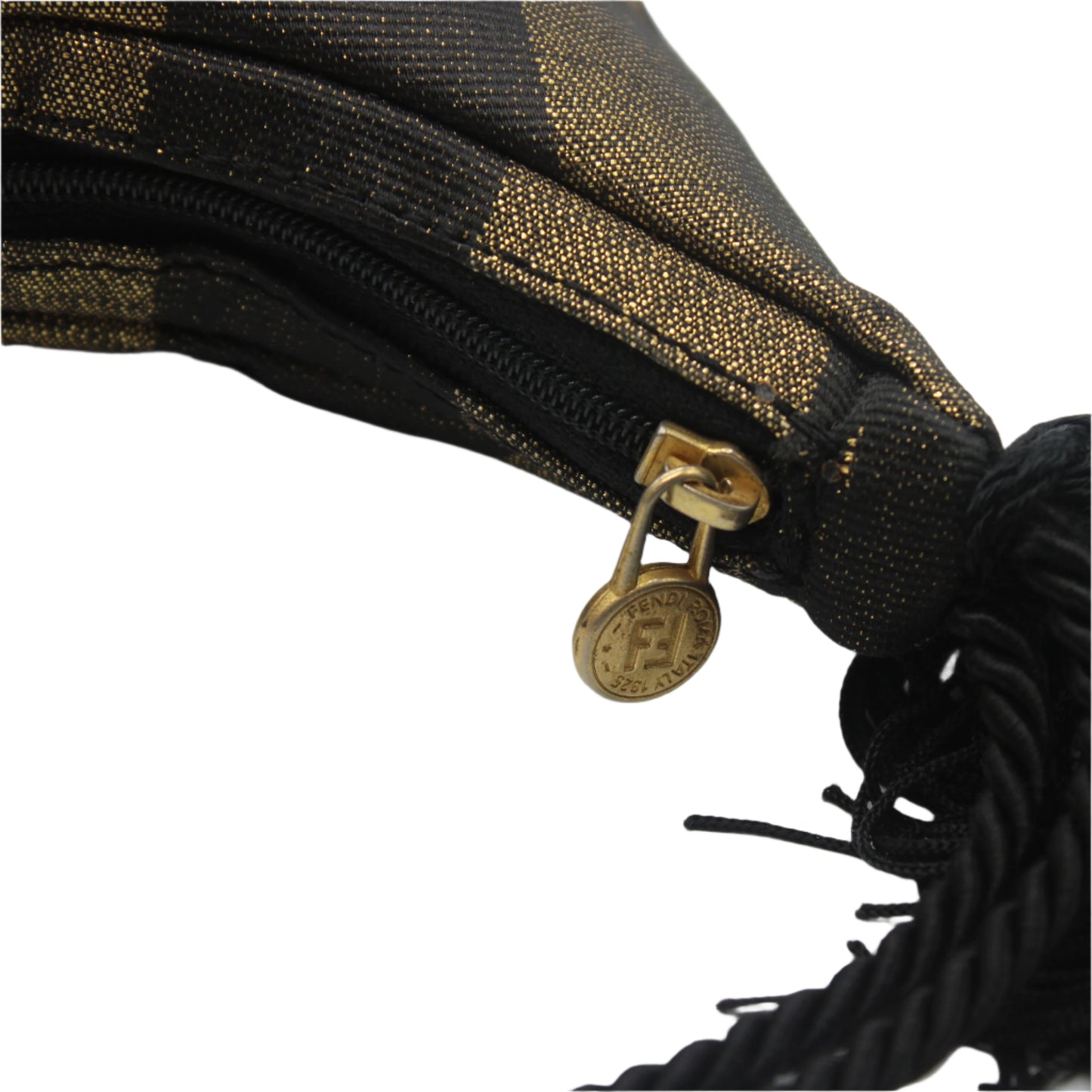 Close-up of a black and gold patterned bag with a gold zipper pull on a white background
