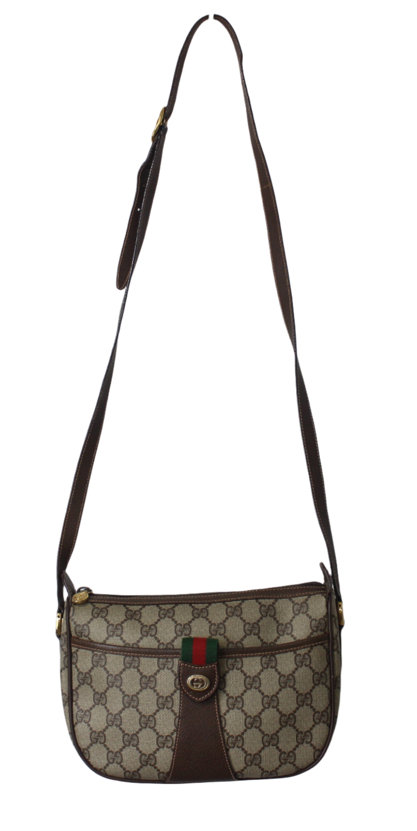 Designer handbag with brown strap on a light gray background