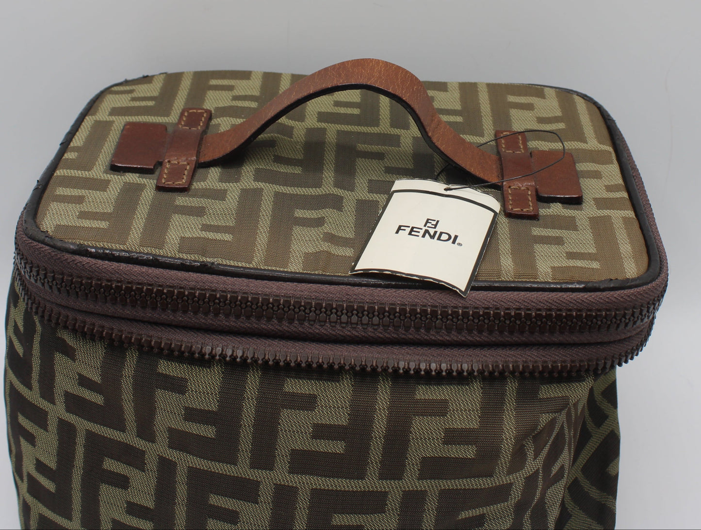 Fendi bag with a visible tag on a white background