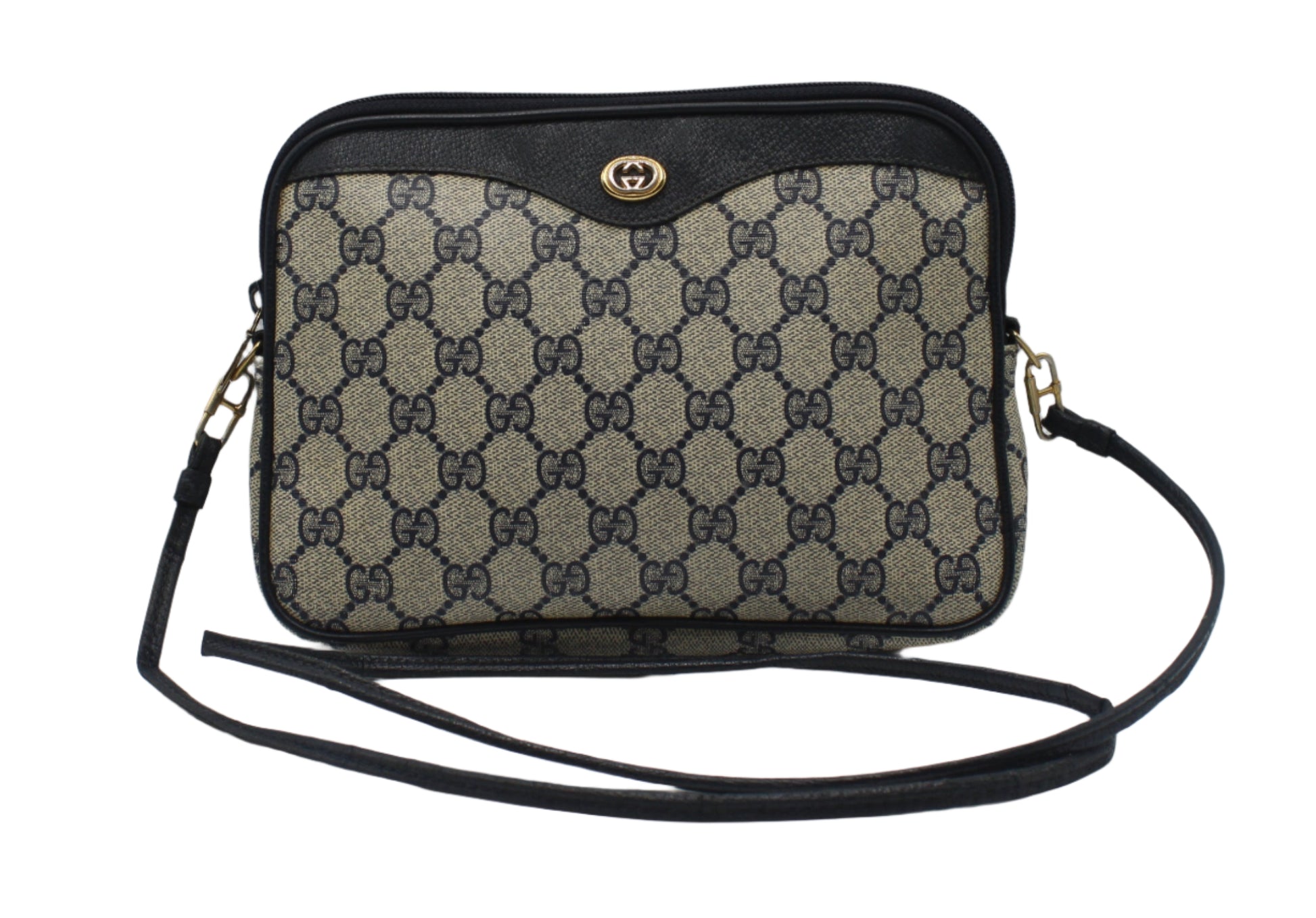 Gucci Beige GG Coated Canvas Navy Leather Crossbody Bag Designer handbag with monogram pattern on a light gray background