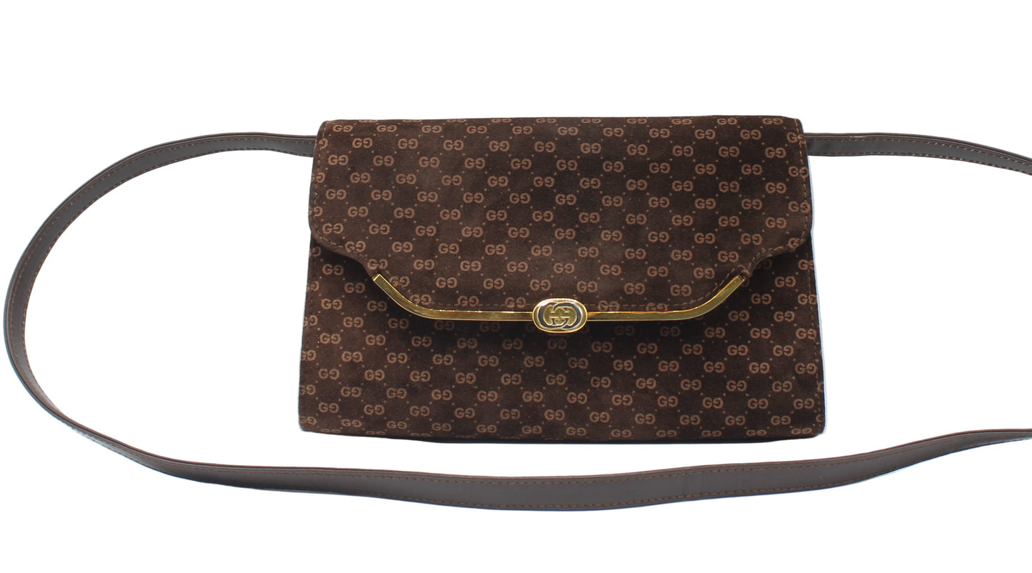 Gucci Brown Suede Micro GG Monogram Leather Flap Crossbody Bag Brown patterned handbag with a gold clasp on a white background