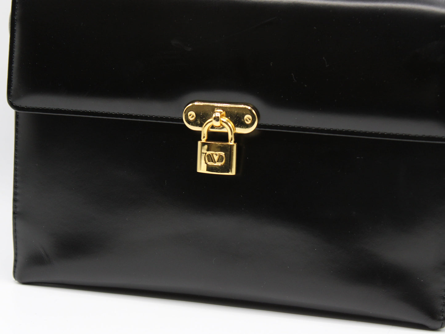 Valentino Garavani Vsling Black Leather Crossbody Bag Lock Charm close view