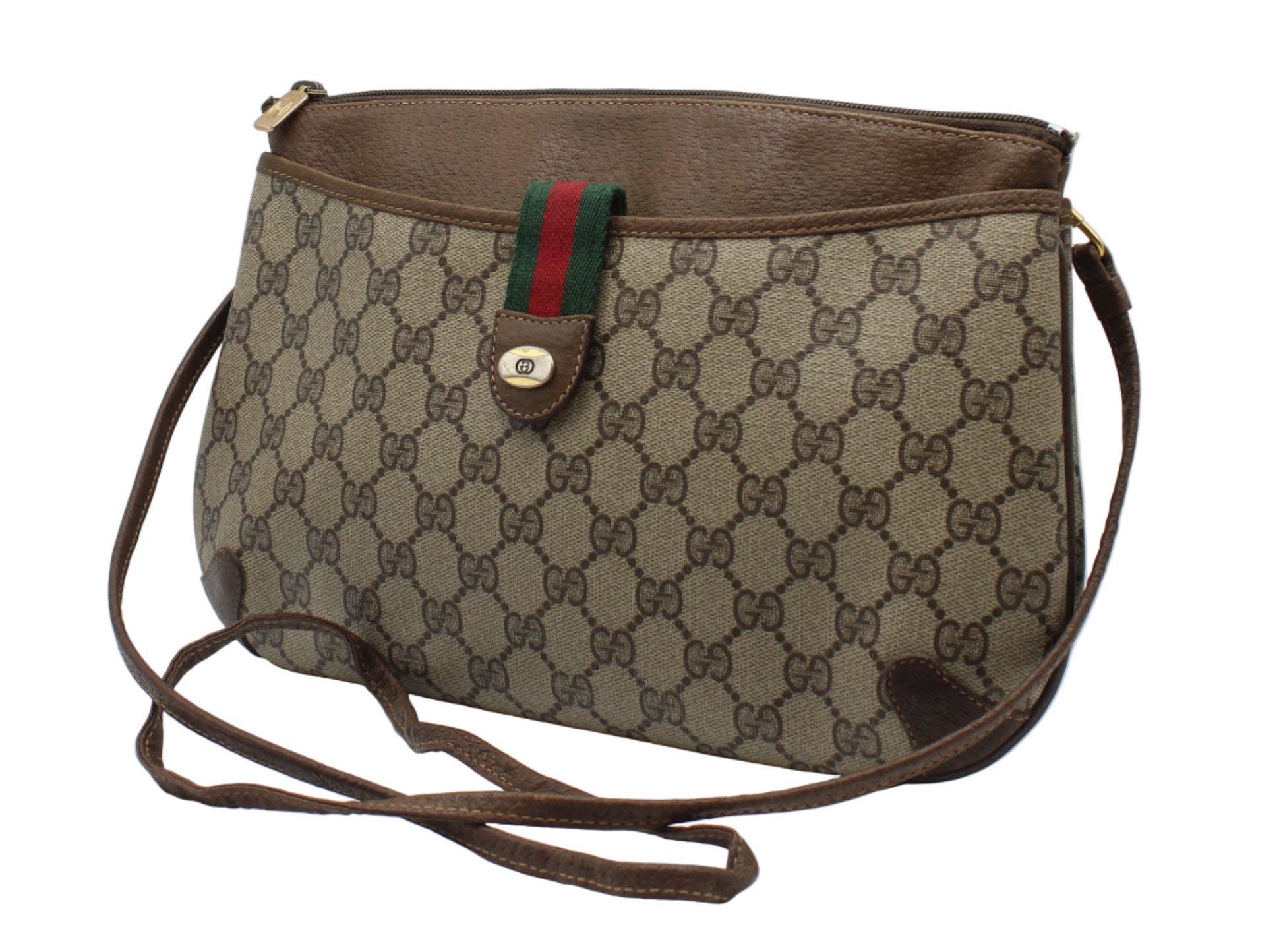 Brown Gucci handbag with patterned strap on a white background
