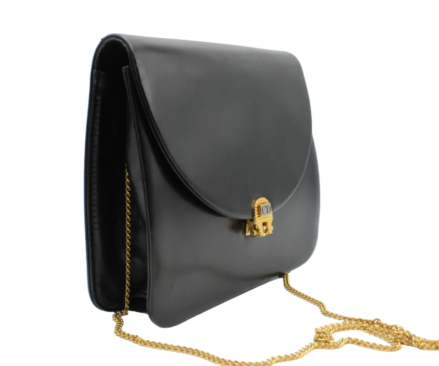 Black handbag with a gold chain on a light gray background