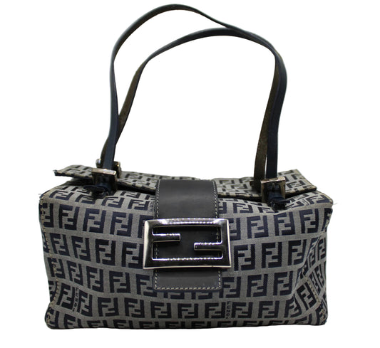 Fendi Navy Zucca Canvas Leather Mini Baguette Bag Patterned handbag with a prominent logo on a light gray background