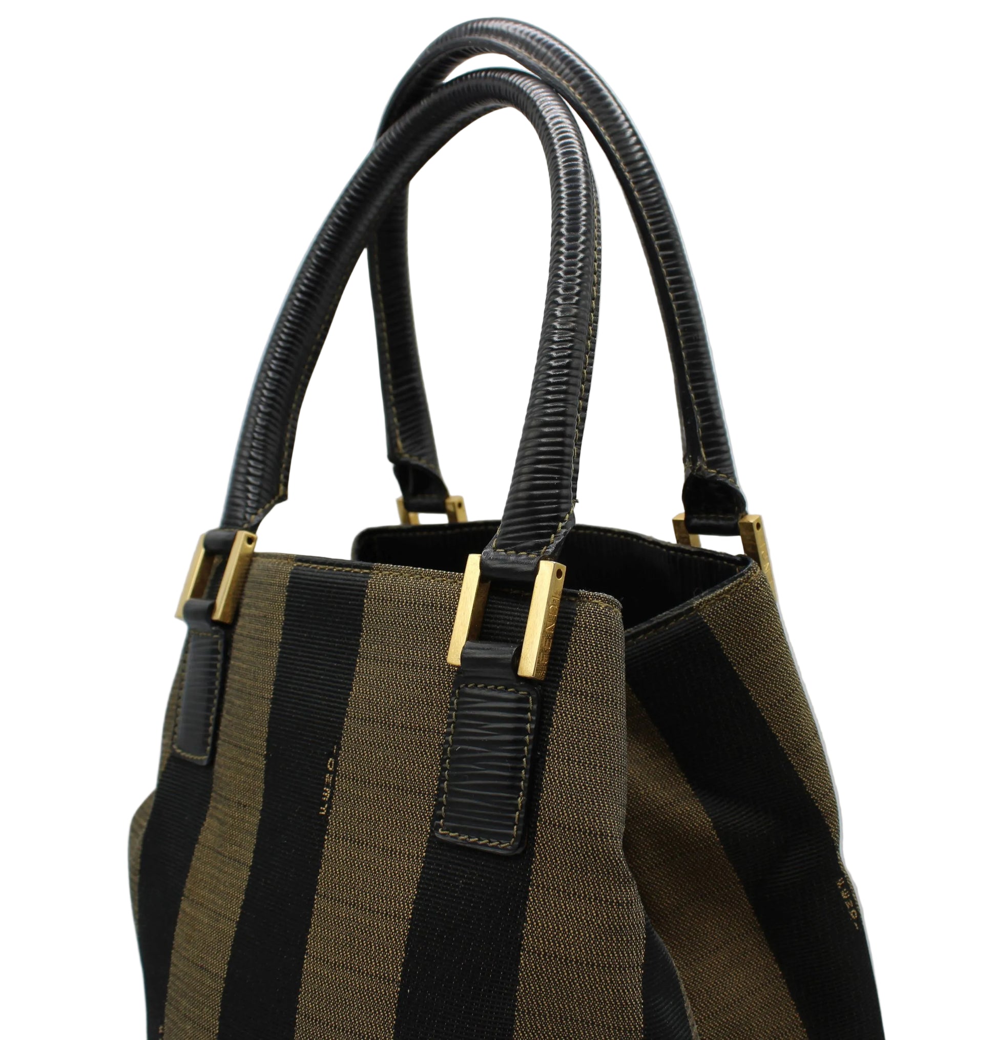 Brown and black striped handbag with gold accents on a light gray background