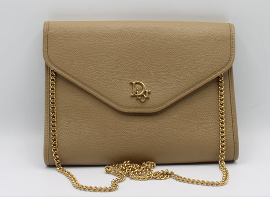 Christian Dior Beige Grained Leather Chain Crossbody Bag Beige handbag with gold chain and logo on a white background