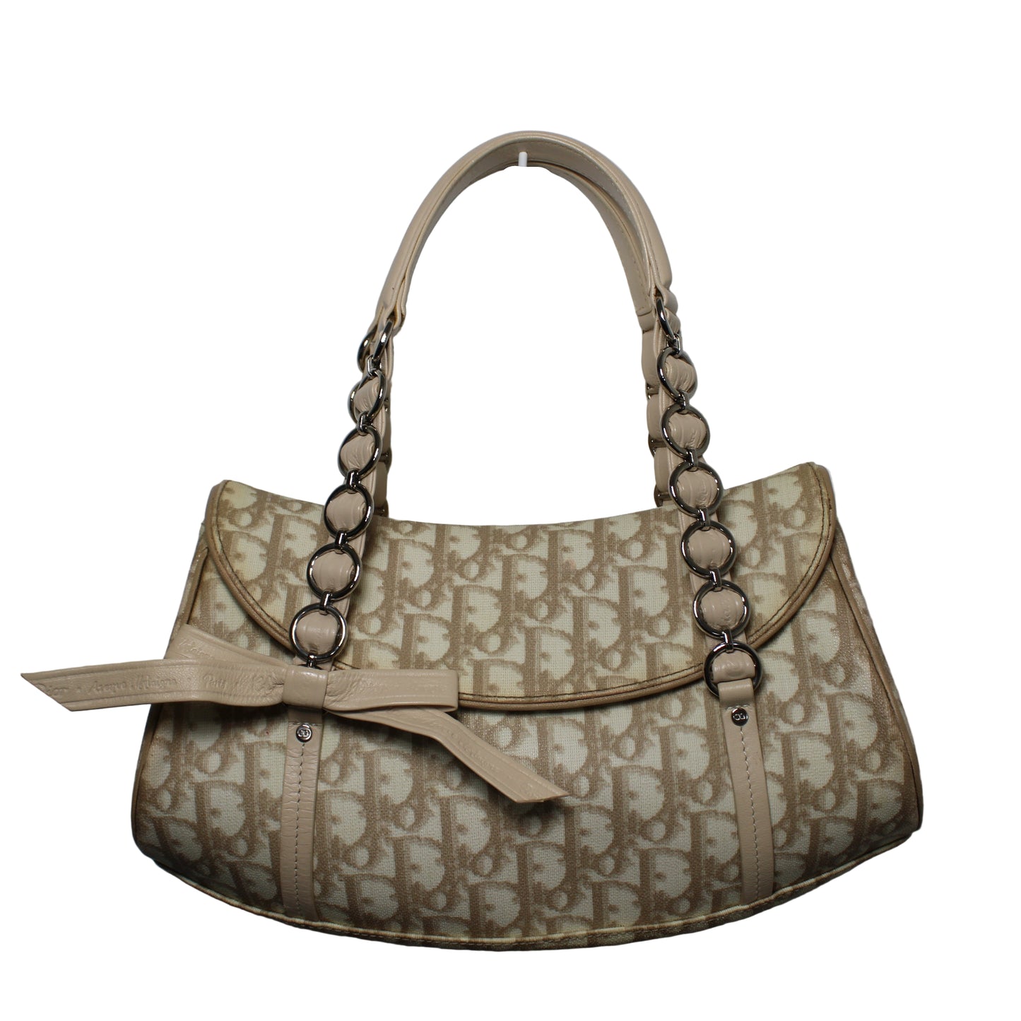 Christian Dior Beige Trotter Canvas Romantique Leather Bow Flap Bag Beige handbag with chain detail on a gray background