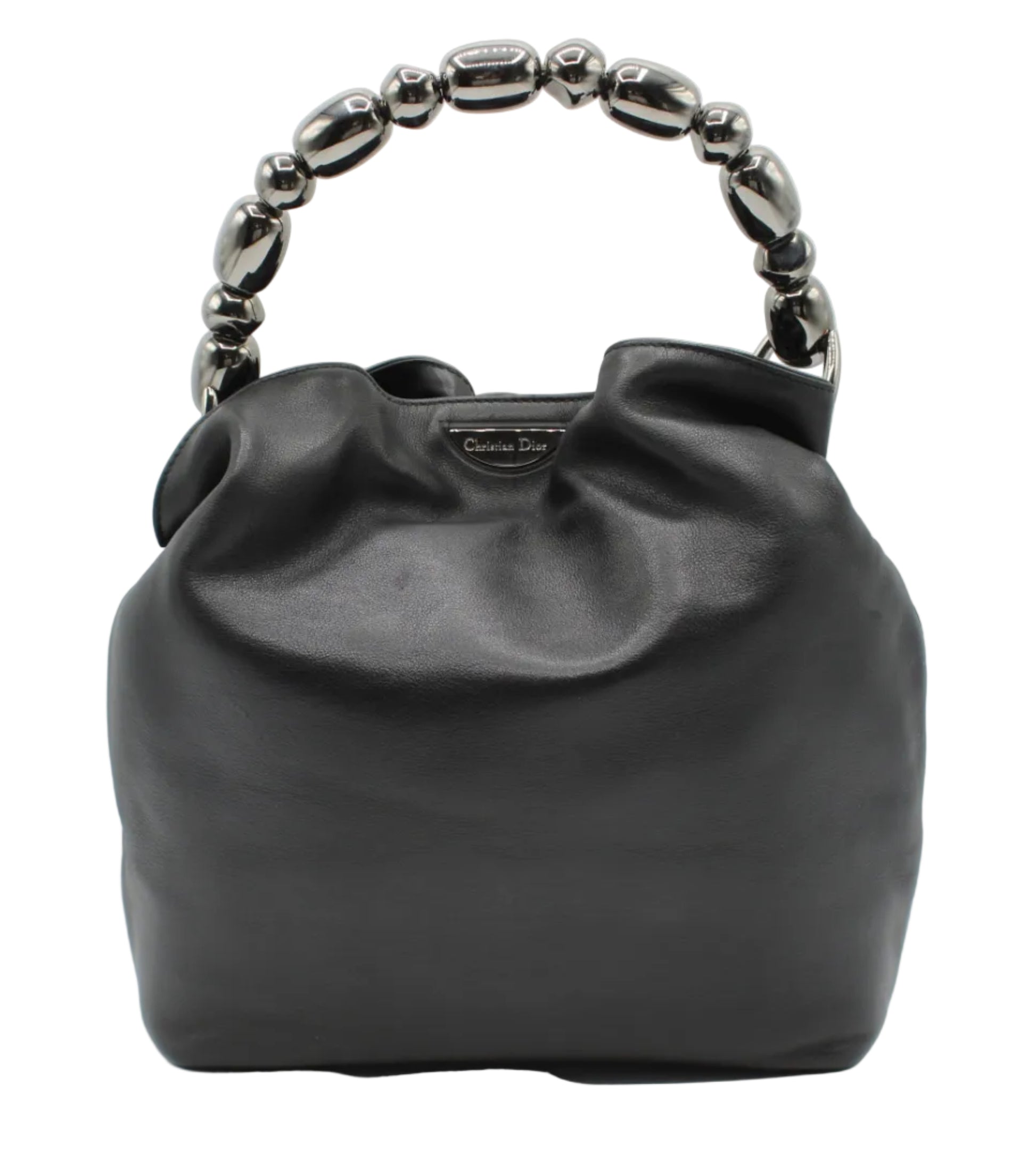 Black handbag with decorative handle on a white background Christian Dior Black Lambskin Malice Bucket Handbag