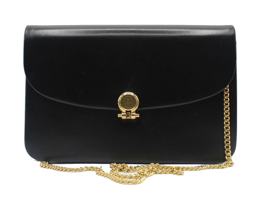 Black handbag with a gold chain and clasp on a white background Christian Dior Black Leather Gold Chain Flap Shoulder Bag