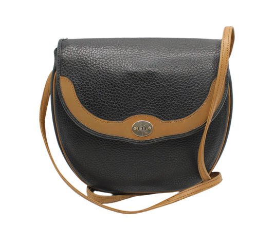 Christian Dior Black Pebbled Leather Flap Crossbody Bag Black leather handbag with brown strap on a white background