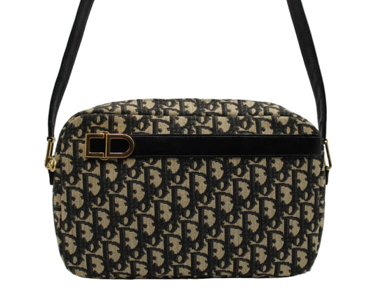 Christian Dior Black Trotter Canvas Leather Strap Shoulder Bag Patterned handbag with a gold clasp on a white background