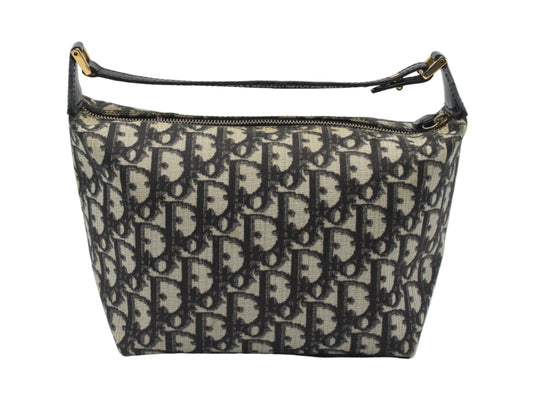 Christian Dior Black Trotter Canvas Patent Leather Handle Handbag Designer handbag with monogram pattern on a light gray background