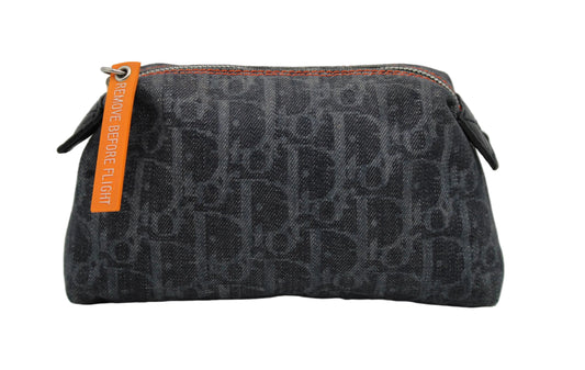 Christian Dior Blue Denim Oblique Flight Pouch Gray Dior pouch with orange tag on a gray background