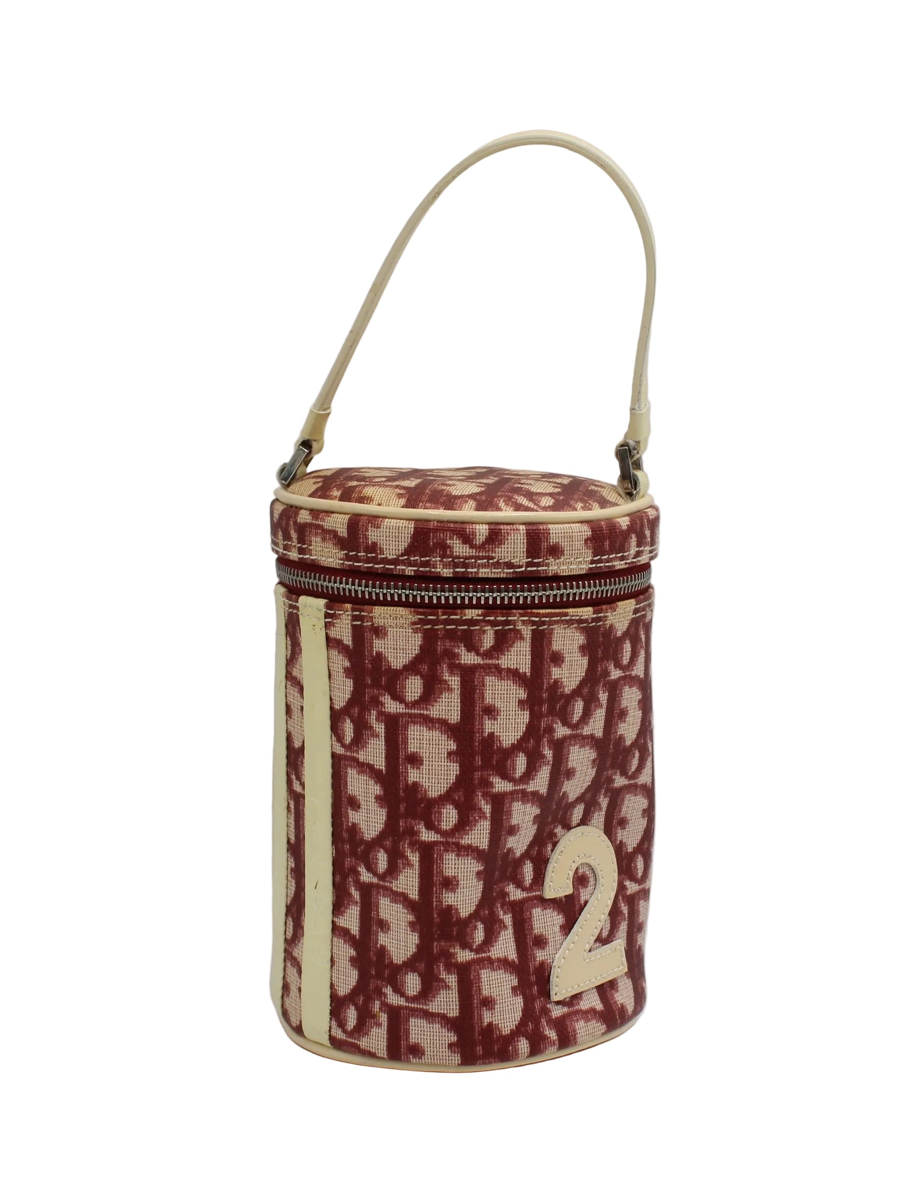 Christian Dior Burgundy Oblique Canvas Number 2 Cylindrical Vanity Handbag Red and beige patterned cylindrical bag with a visible brand logo on a white background
