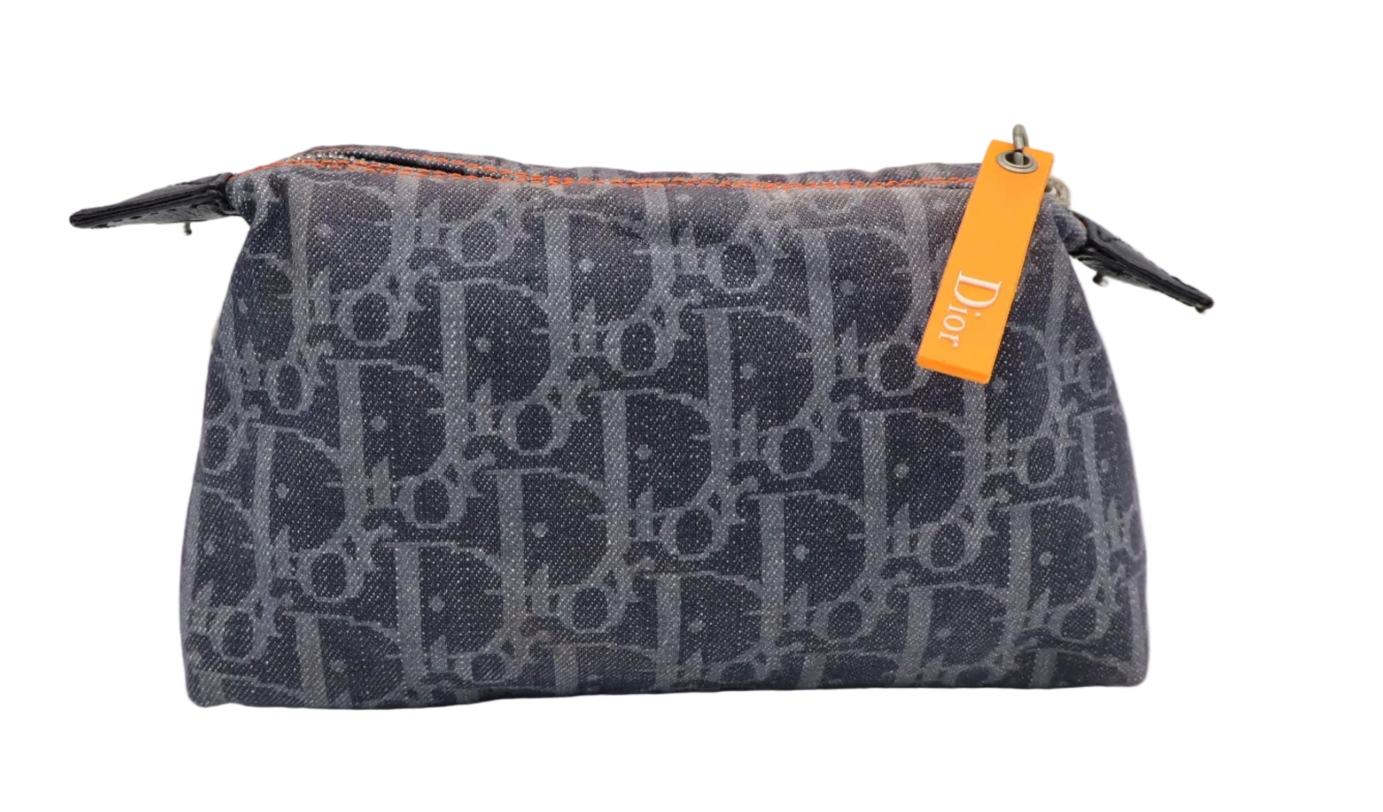Christian Dior Navy Trotter Flight Canvas Phone Pouch A Dior monogram canvas toiletry bag in navy blue with a signature orange hangtag, photographed on a neutral light gray background.