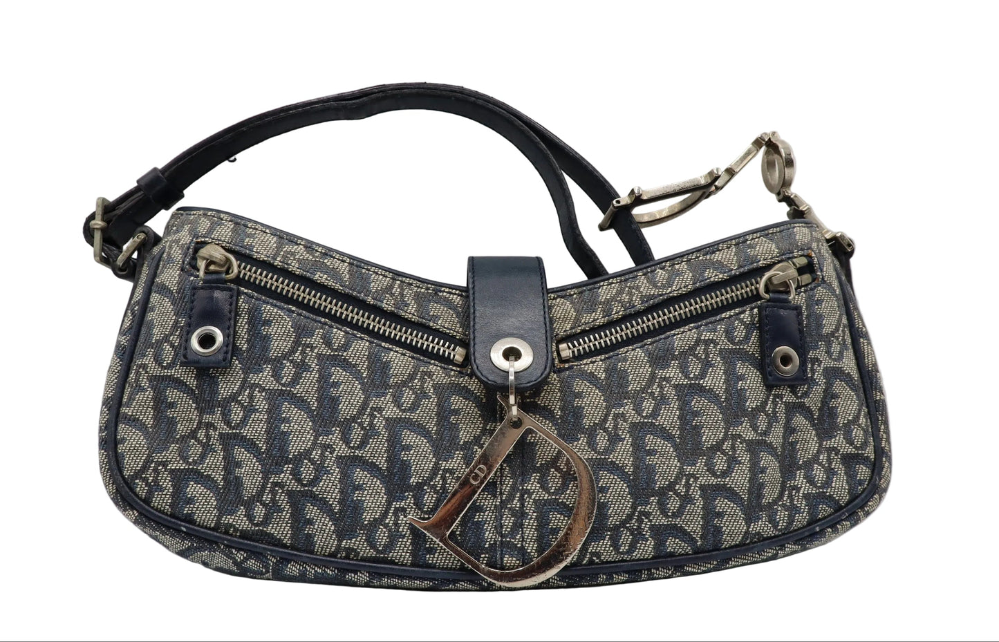Christian Dior Navy Trotter Oblique Canvas Flap Shoulder Bag A Dior monogram shoulder bag in navy blue and beige canvas, featuring a dark navy leather strap, silver-tone hardware, and a hanging Dior key tag, photographed on a light gray background.
