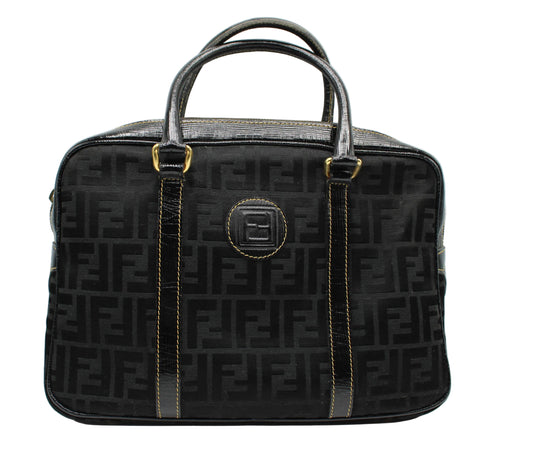 Fendi Black Zucca Canvas Leather Trim Boston Bag Black patterned handbag with gold accents on a white background