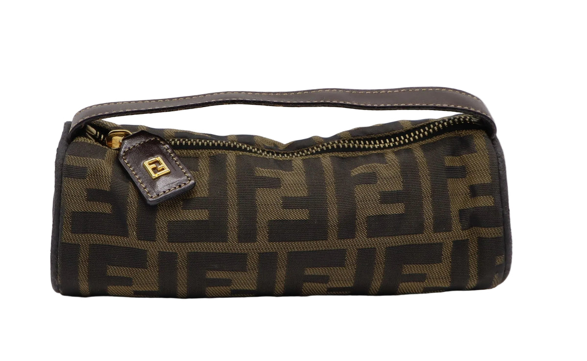 Fendi Brown Zucca Canvas Cylinder Mini Handbag A Fendi toiletry bag in brown and black Zucca monogram canvas with a brown leather handle and a gold-tone zipper, shown on a light gray background.