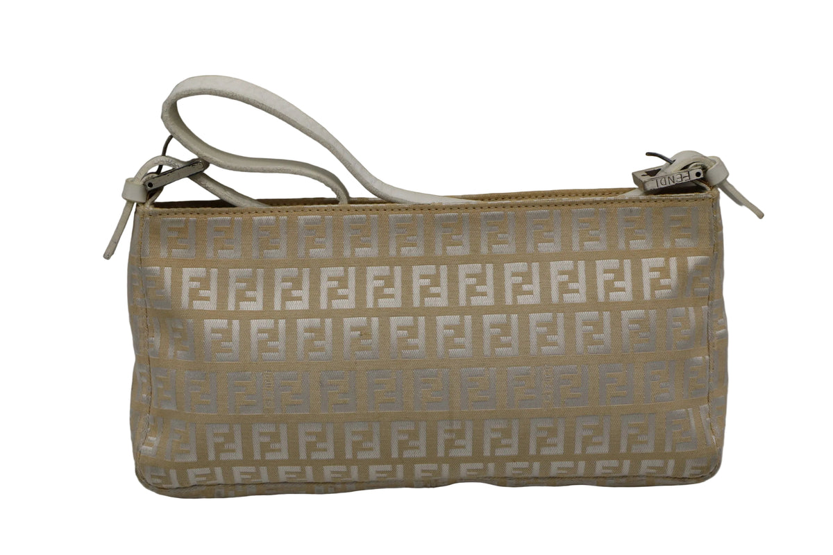 Fendi Off White Zucca Canvas Leather Shoulder Bag A vintage Fendi clutch bag in beige and white monogram canvas with a white leather wristlet strap, shown against a neutral gray background.