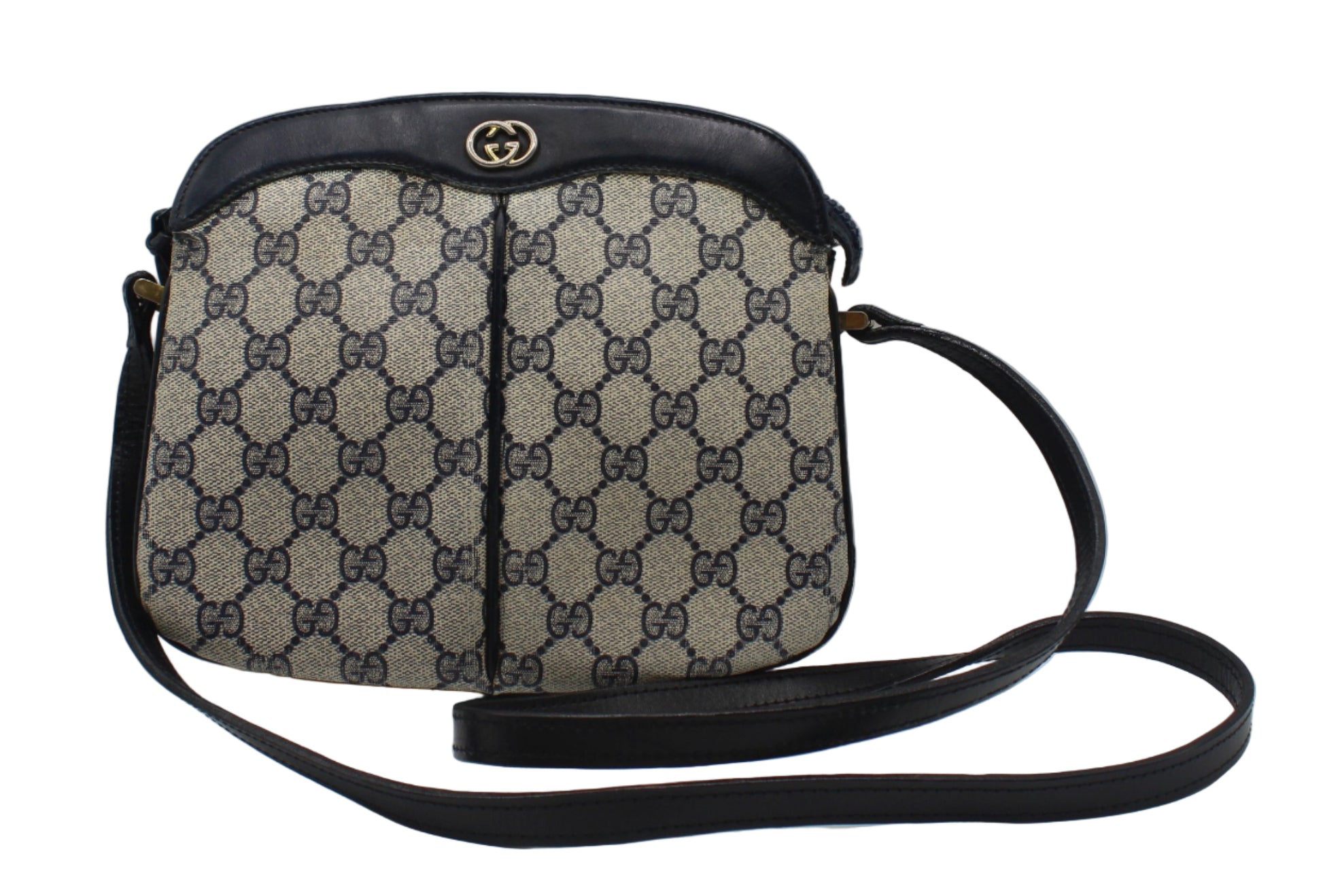 Gucci Beige And Navy GG Canvas Leather Trim Crossbody Bag Designer handbag with patterned fabric and black leather accents on a light gray background