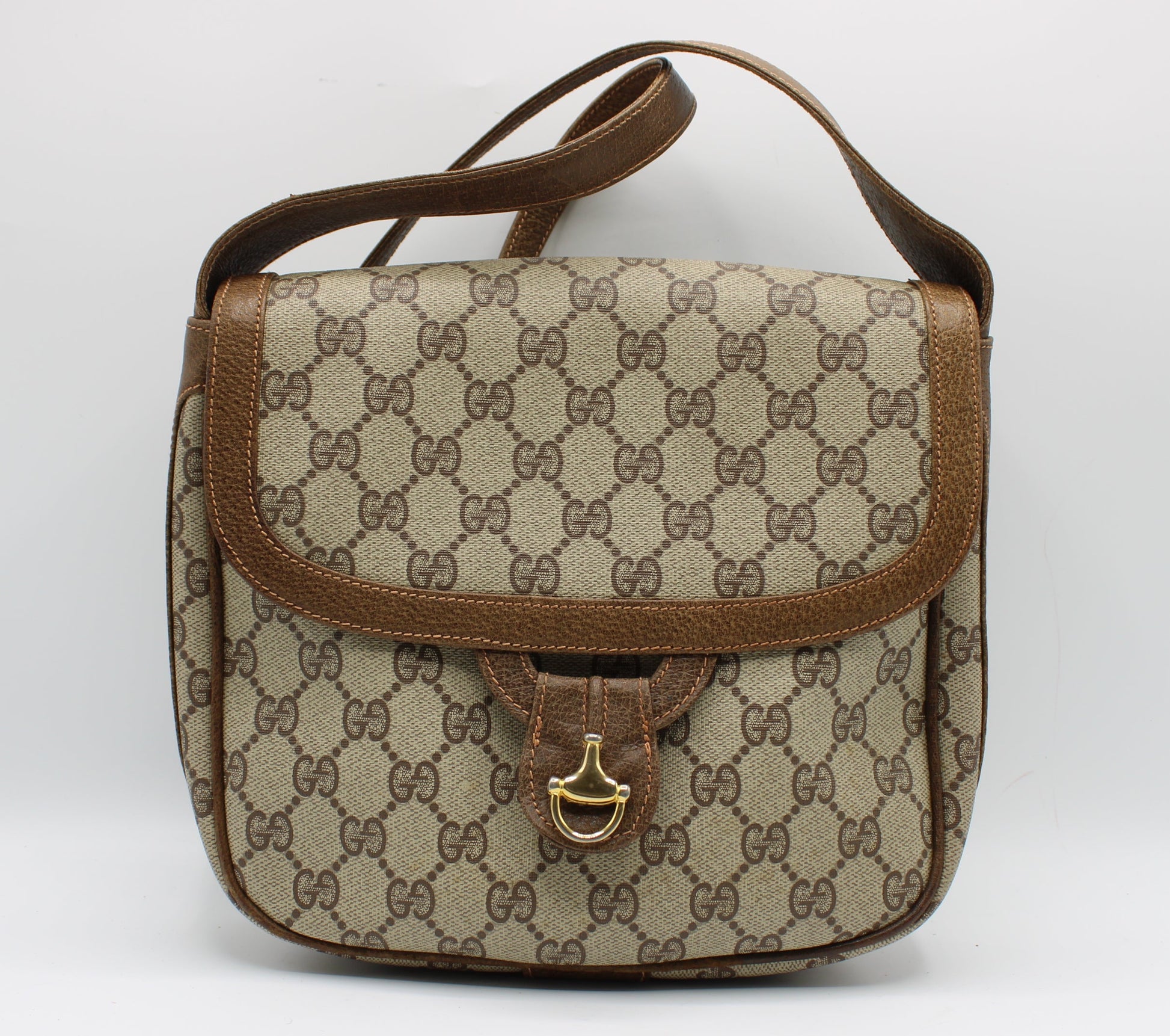 Beige handbag with brown accents on a white background Gucci Beige Brown Gg Canvas Leather Flap Shoulder Bag