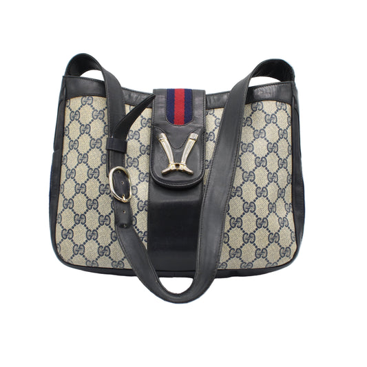 Gucci Navy Leather Gg Canvas Boots Flap Shoulder Bag Designer handbag with patterned fabric and black accents on a white background