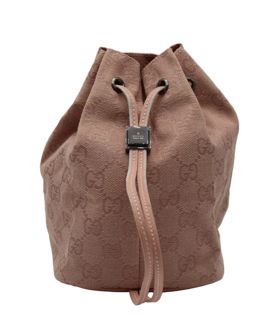 Gucci Pink GG Canvas Drawstring Bucket Mini Bag PINK drawstring bag with Gucci logo on a light gray background