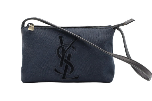 Yves Saint Laurent Black Canvas Velvet Logo Shoulder Bag A dark navy blue canvas crossbody bag with a black embossed YSL logo and a black leather strap, shown on a white background.